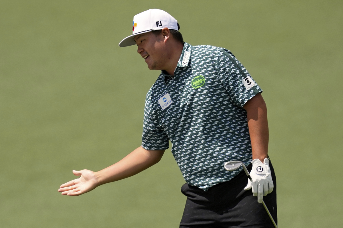 Sungjae Im, of South Korea, celebrates after chipping in for eagle on second hole during the third round at the Masters golf tournament, Saturday, April 12, 2025, in Augusta, Ga. (AP Photo/David J. Phillip)